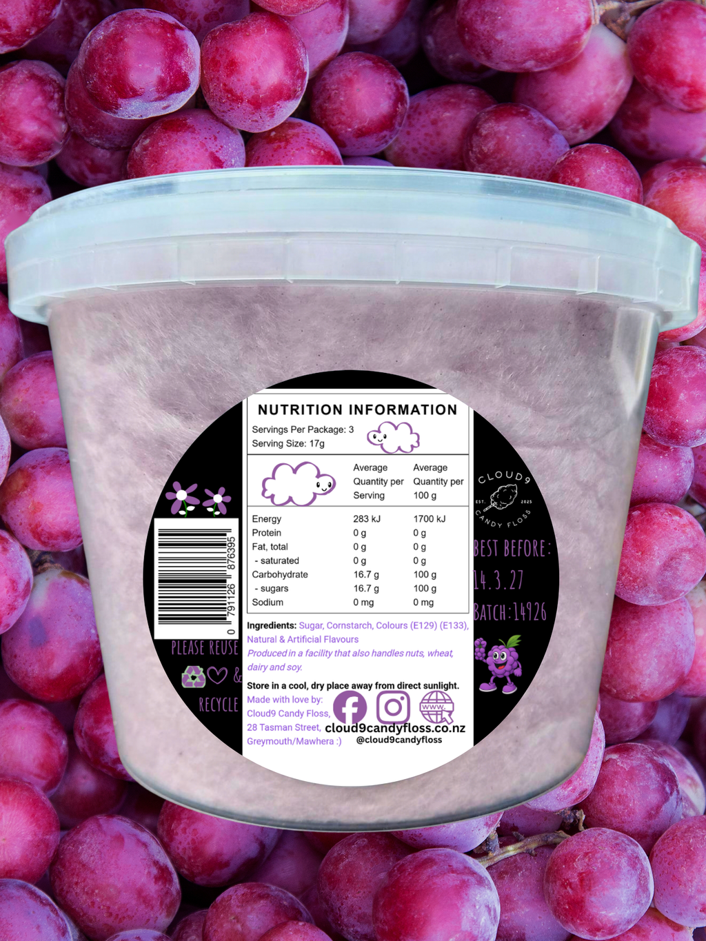 Purple grape flavoured candyfloss in a clear tub with rear label. Purple grapes form the background. 
